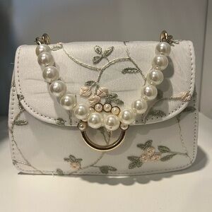 Embroidered flowered purse with pearl detail